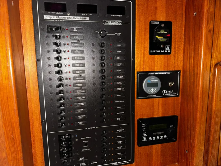  Yacht Photos Pics Electrical panel on a 1990 Little Harbor Express 36 yacht, featuring various controls and monitors.