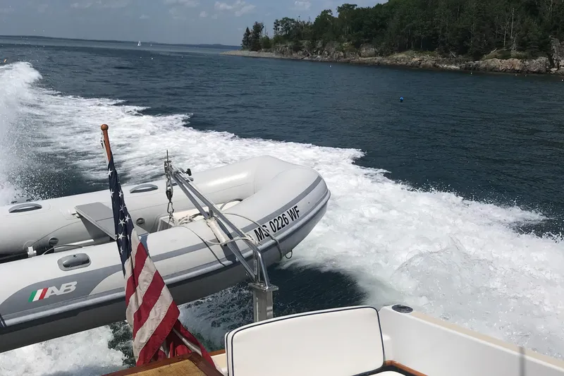  Yacht Photos Pics Little Harbor Express 36 boat cruising with inflatable dinghy and American flag.
