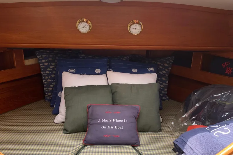  Yacht Photos Pics Cozy cabin interior of 1990 Little Harbor Express 36 with decorative pillows and nautical theme.