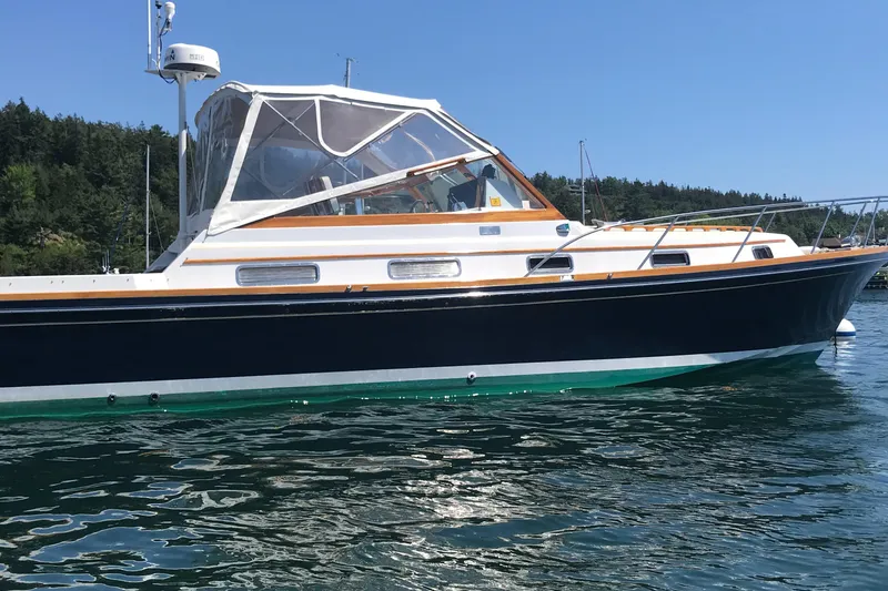  Yacht Photos Pics 1990 Little Harbor Express 36 boat on calm water, clear sky background.