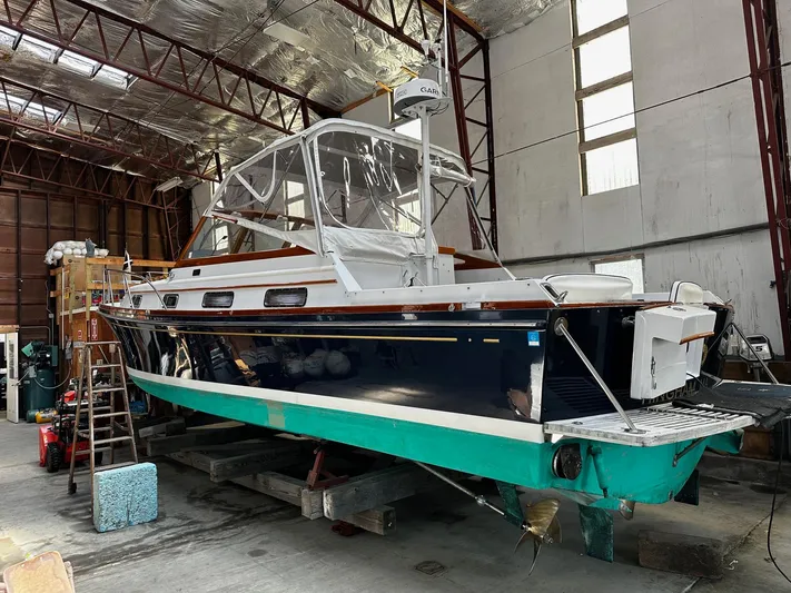  Yacht Photos Pics 1990 Little Harbor Express 36 boat in a warehouse, undergoing maintenance.