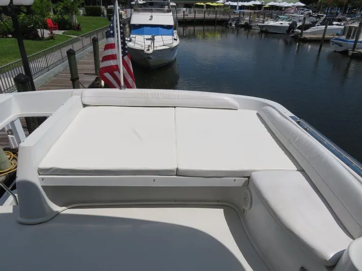  Yacht Photos Pics Bluewater Yachts Millennium Series 63, 2000 model, featuring spacious deck seating at marina.