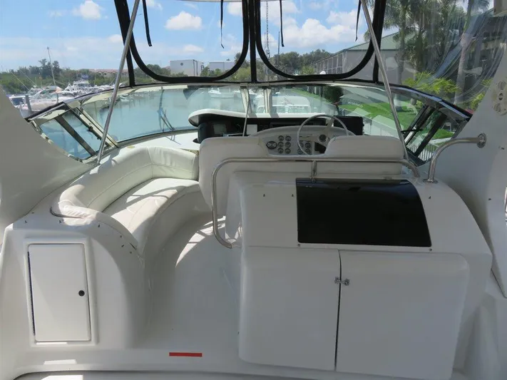  Yacht Photos Pics Cockpit of 2000 Bluewater Yachts Millennium Series 63 with white seating and control panel.