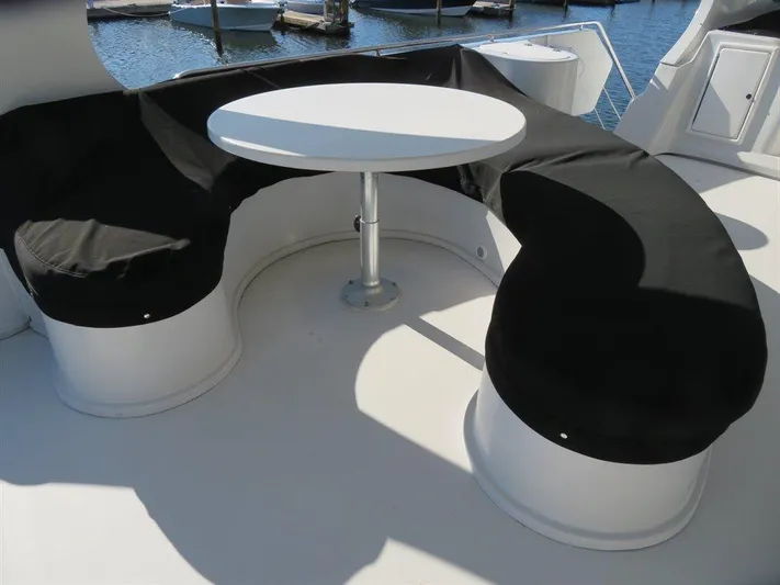 Yacht Photos Pics Curved seating with table on 2000 Bluewater Yachts Millennium Series 63.