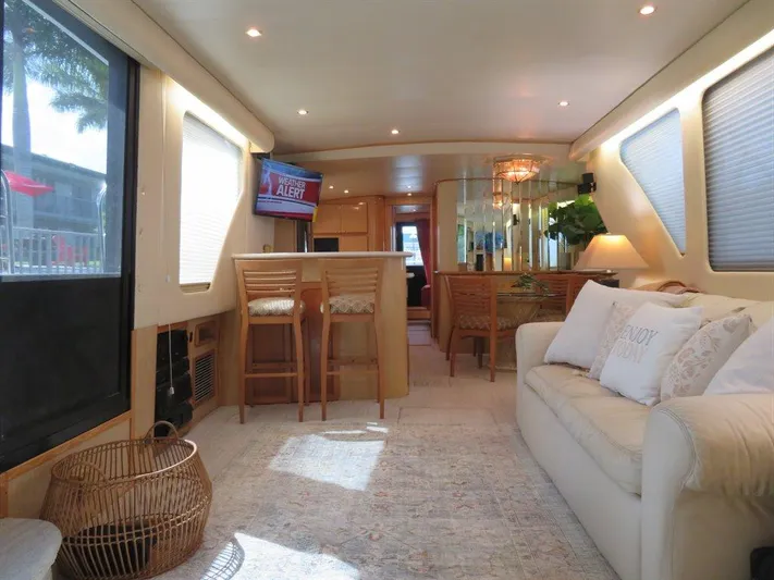  Yacht Photos Pics Luxurious interior of 2000 Bluewater Yachts Millennium Series 63 with elegant seating and dining area.