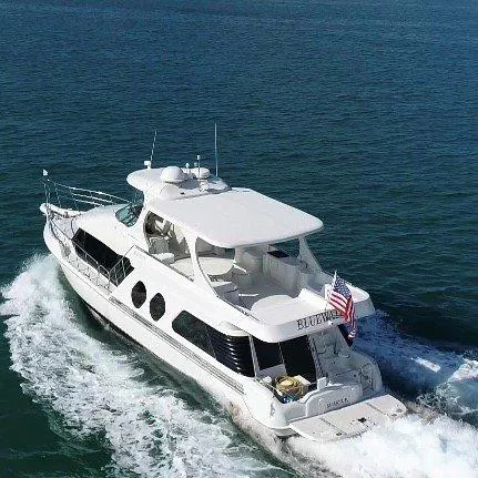  Yacht Photos Pics 2000 Bluewater Yachts Millennium Series 63 cruising on open water.