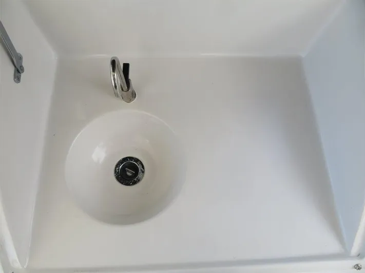  Yacht Photos Pics White sink with chrome faucet in Bluewater Yachts Millennium Series 63, 2000 model.