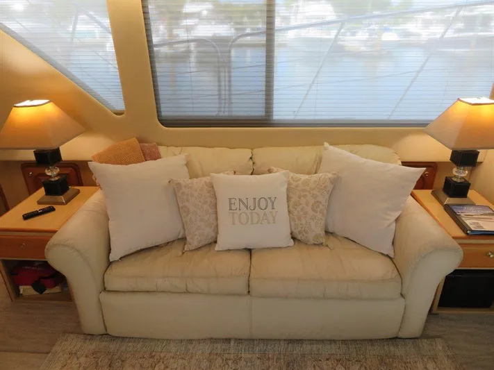  Yacht Photos Pics Luxurious interior of 2000 Bluewater Yachts Millennium Series 63 with cozy sofa and decor.