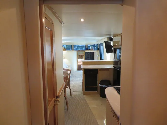  Yacht Photos Pics Interior of 2000 Bluewater Yachts Millennium Series 63, featuring modern kitchen and dining area.