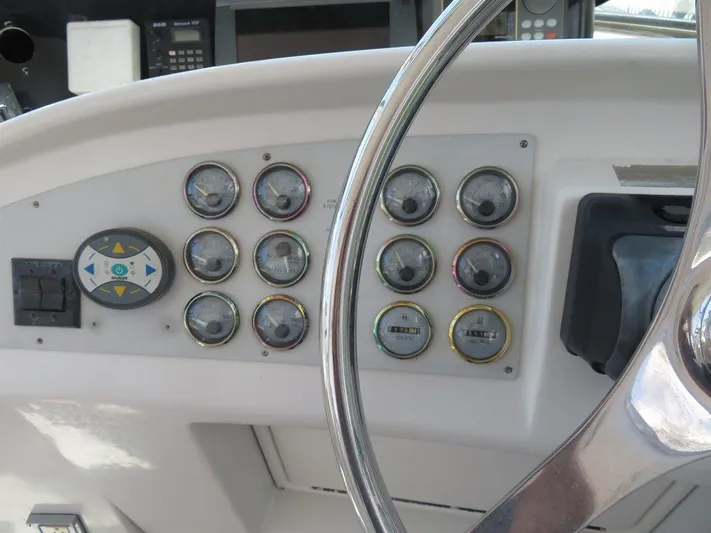  Yacht Photos Pics Dashboard of 2000 Bluewater Yachts Millennium Series 63 with gauges and controls.