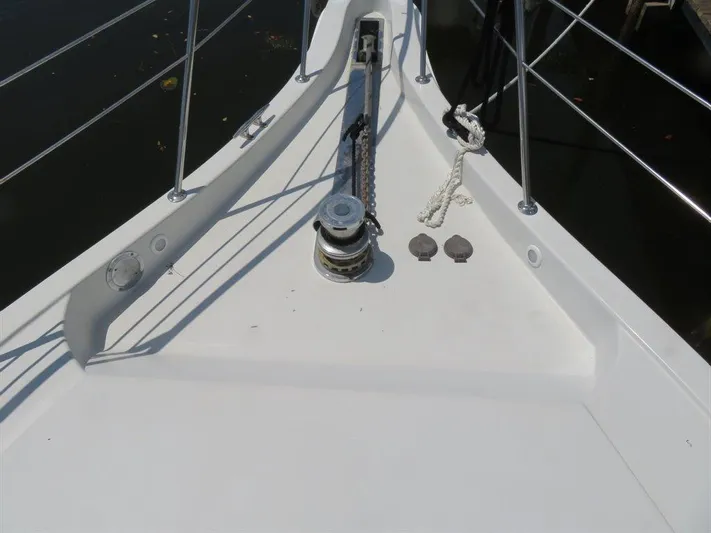  Yacht Photos Pics Bow of 2000 Bluewater Yachts Millennium Series 63 with anchor winch.