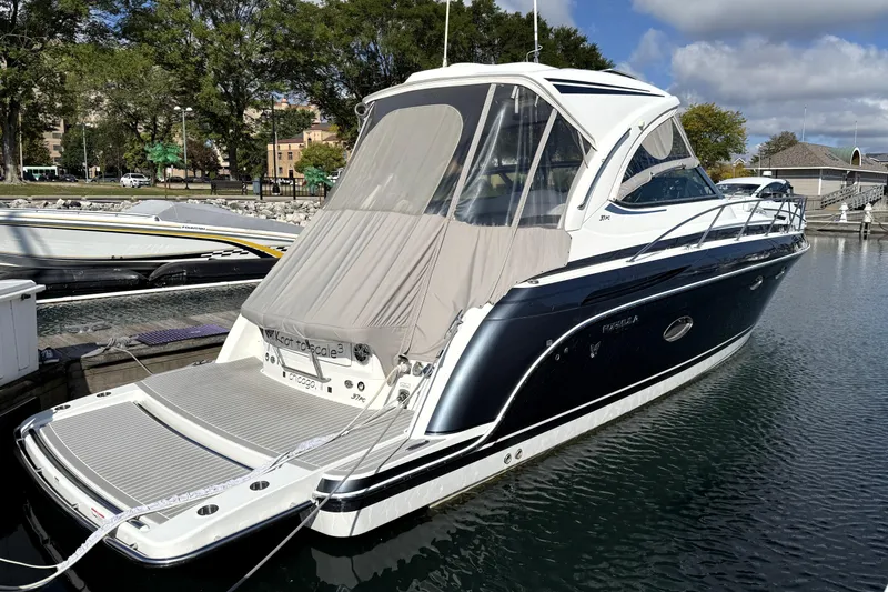 Knot To Scale Yacht Photos Pics 2018 Formula 37 Performance Cruiser docked at a marina, featuring sleek design and modern amenities.