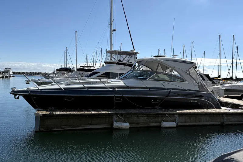 Knot To Scale Yacht Photos Pics 2018 Formula 37 Performance Cruiser docked at marina under clear blue sky.