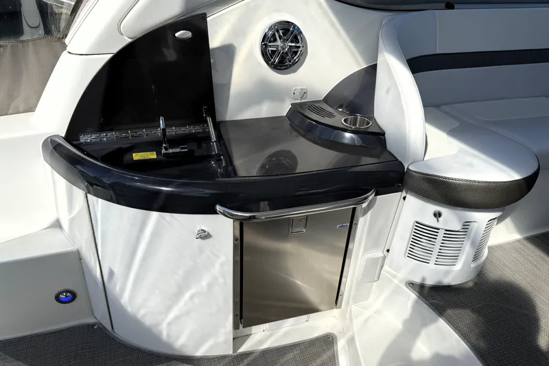 Knot To Scale Yacht Photos Pics 2018 Formula 37 Performance Cruiser interior with sleek kitchenette and seating area.