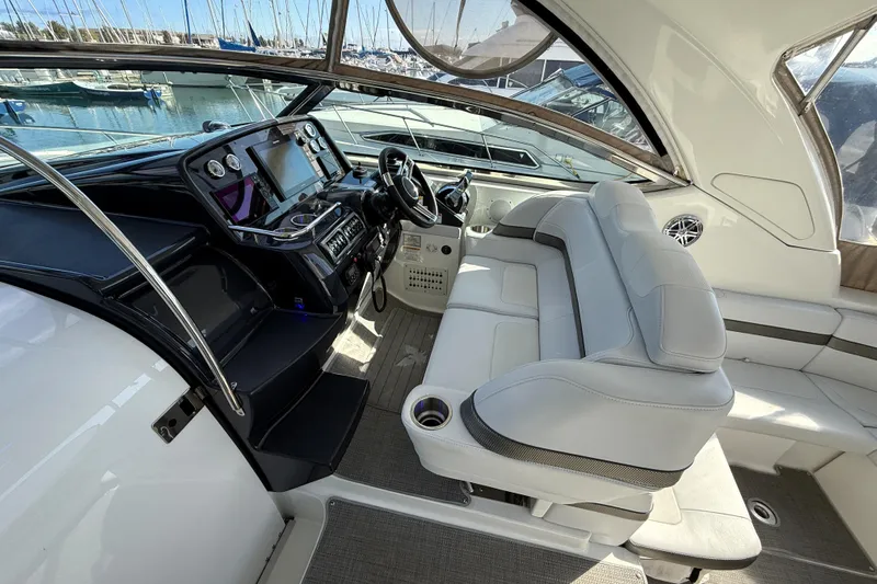 Knot To Scale Yacht Photos Pics 2018 Formula 37 Performance Cruiser interior with helm and seating area.