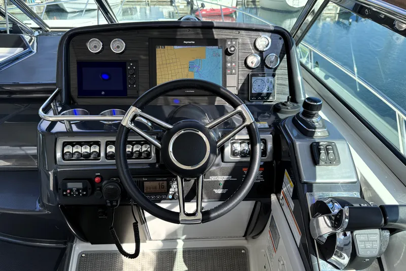 Knot To Scale Yacht Photos Pics Cockpit of 2018 Formula 37 Performance Cruiser with navigation and control systems.