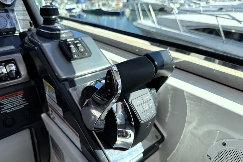Knot To Scale Yacht Photos Pics 2018 Formula 37 Performance Cruiser throttle controls in cockpit, marina background.