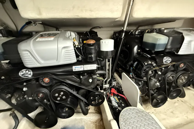 Knot To Scale Yacht Photos Pics Engine compartment of a 2018 Formula 37 Performance Cruiser, showcasing dual engines and components.