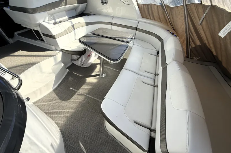 Knot To Scale Yacht Photos Pics 2018 Formula 37 Performance Cruiser interior with white seating and a central table.