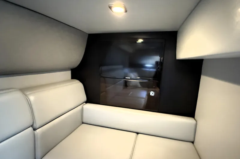 Knot To Scale Yacht Photos Pics Interior of 2018 Formula 37 Performance Cruiser with modern seating and wall-mounted TV.