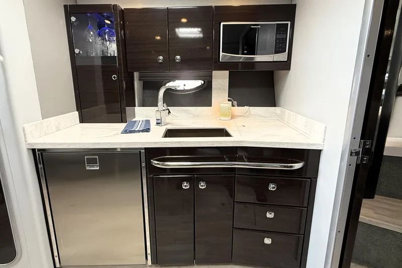 Knot To Scale Yacht Photos Pics 2018 Formula 37 Performance Cruiser kitchen with modern appliances and sleek cabinetry.