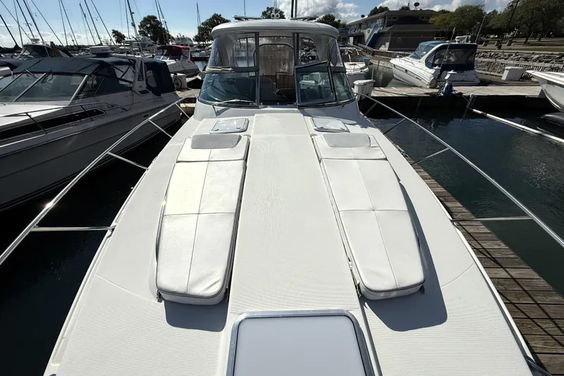 Knot To Scale Yacht Photos Pics 2018 Formula 37 Performance Cruiser docked at marina, showcasing sleek design and spacious deck.