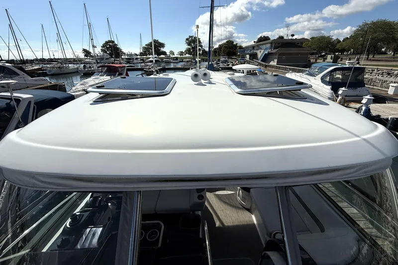 Knot To Scale Yacht Photos Pics 2018 Formula 37 Performance Cruiser docked at marina, sunny day, clear sky.