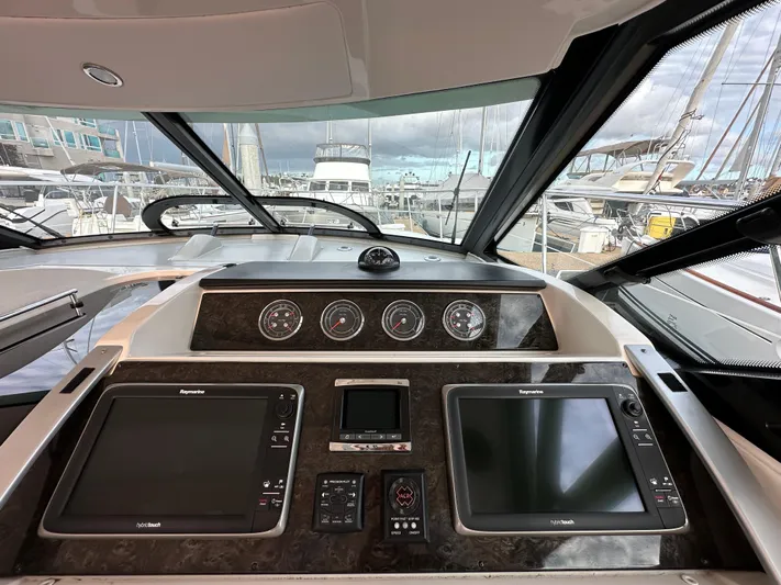 Divine Intervention Yacht Photos Pics 2015 Sea Ray 410 Sundancer helm with navigation screens and gauges at marina.