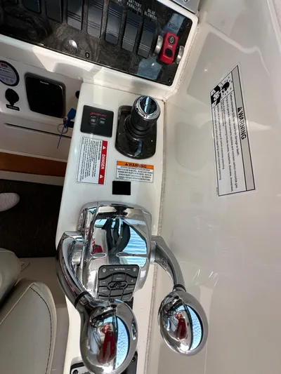 Divine Intervention Yacht Photos Pics Control panel of 2015 Sea Ray 410 Sundancer boat with throttle and switches.