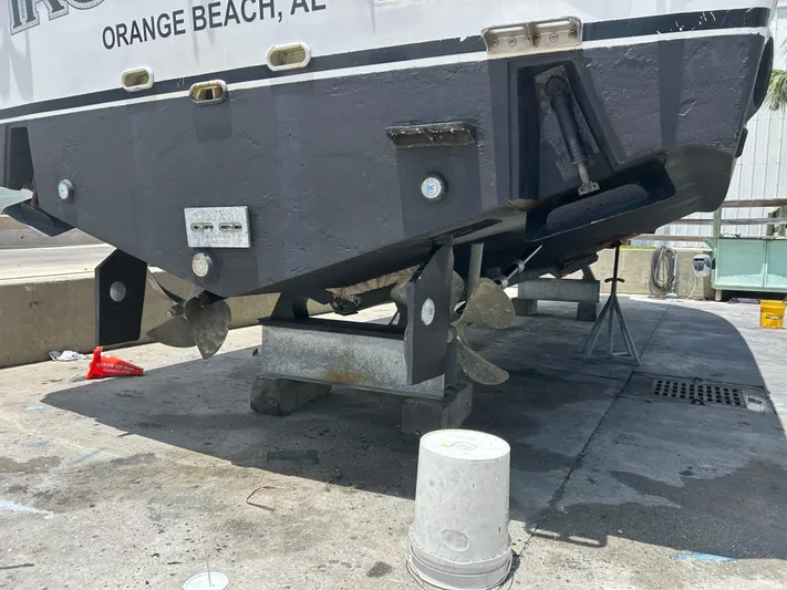 Ironman Yacht Photos Pics 2006 Rampage EXPRESS boat on dry dock, showing propellers and hull details.