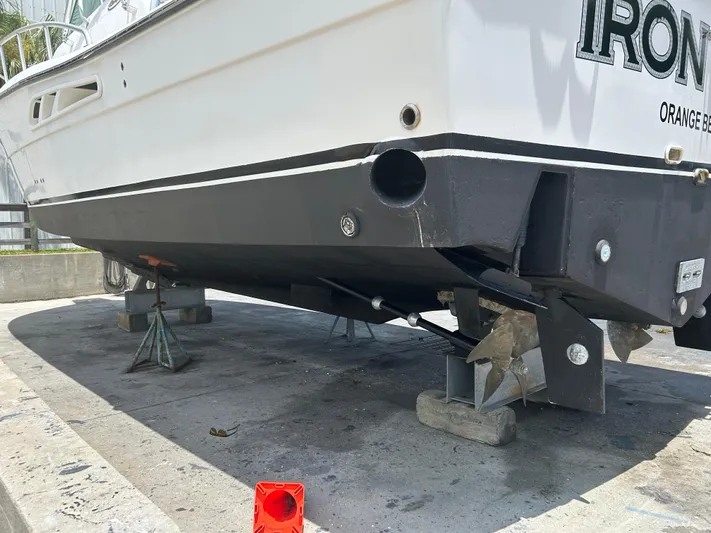 Ironman Yacht Photos Pics 2006 Rampage EXPRESS boat on stands, showing hull and propeller details.