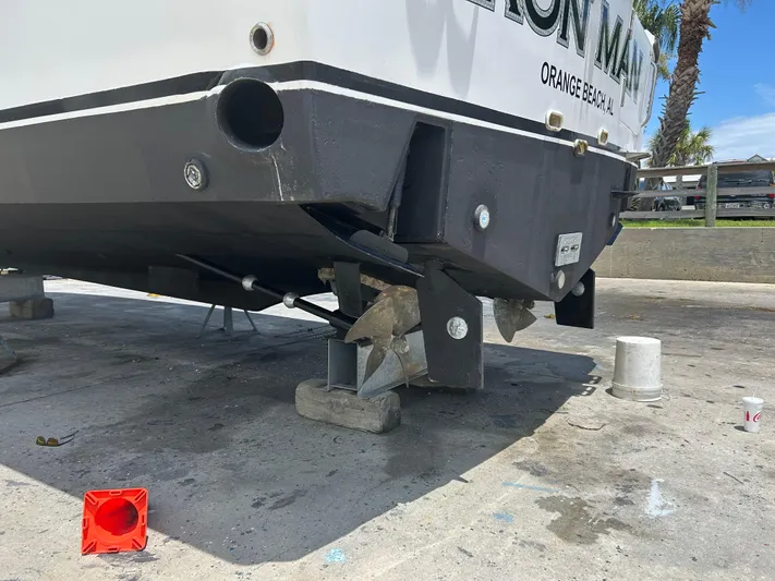 Ironman Yacht Photos Pics 2006 Rampage EXPRESS boat on dry dock, showing propeller and hull details.