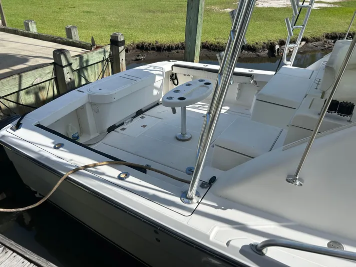 Ironman Yacht Photos Pics 2006 Rampage EXPRESS boat docked, featuring spacious deck and fishing equipment.