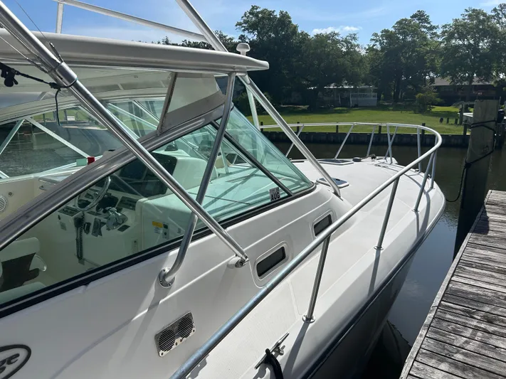 Ironman Yacht Photos Pics 2006 Rampage EXPRESS boat docked, showcasing sleek design and spacious cockpit.