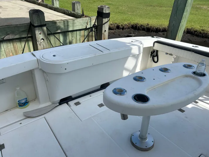 Ironman Yacht Photos Pics 2006 Rampage EXPRESS boat deck with fishing rod holders and storage compartments.