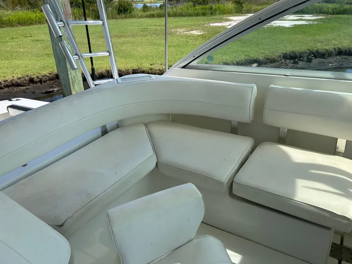 Ironman Yacht Photos Pics 2006 Rampage EXPRESS boat interior with white seating and outdoor view.