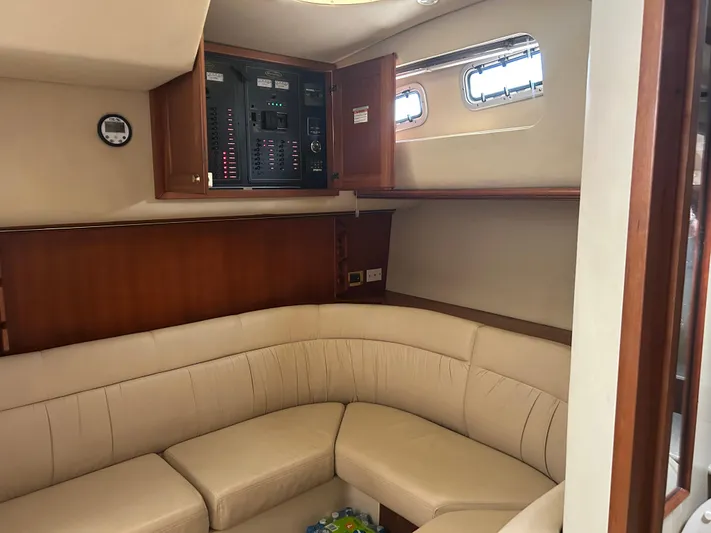 Ironman Yacht Photos Pics 2006 Rampage EXPRESS yacht interior with beige seating and control panel.