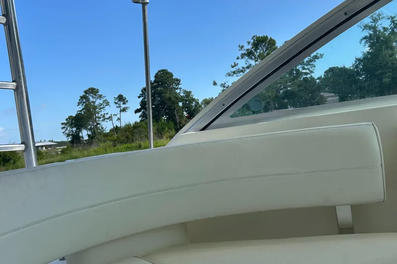 Ironman Yacht Photos Pics 2006 Rampage EXPRESS boat interior with white seating and scenic outdoor view.