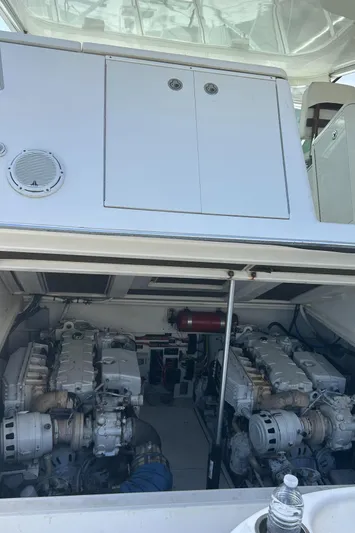 Ironman Yacht Photos Pics Engine compartment of a 2006 Rampage EXPRESS boat, showcasing dual engines and mechanical components.