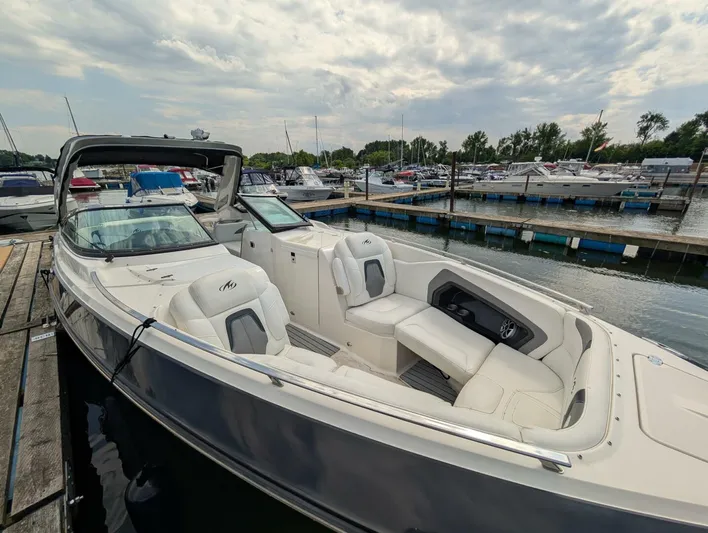  Yacht Photos Pics 2011 Monterey 328 SS boat docked at marina, featuring sleek design and spacious seating.
