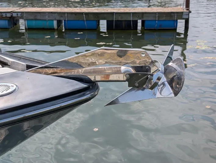  Yacht Photos Pics Bow of 2011 Monterey 328 SS with stainless steel anchor, dock in background.