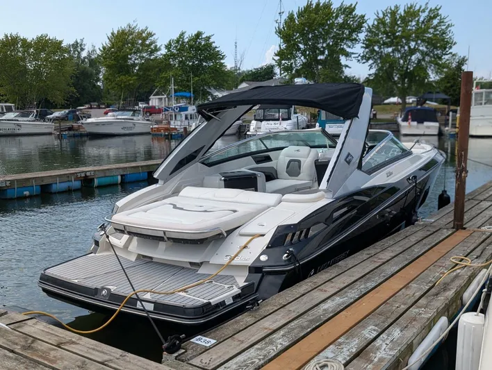  Yacht Photos Pics 2011 Monterey 328 SS boat docked at marina, featuring sleek design and comfortable seating.