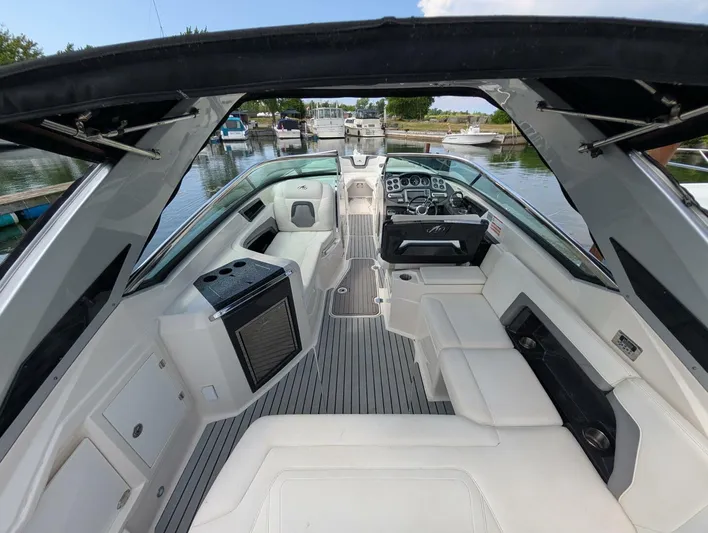  Yacht Photos Pics Interior view of a 2011 Monterey 328 SS boat with luxurious seating and modern dashboard.