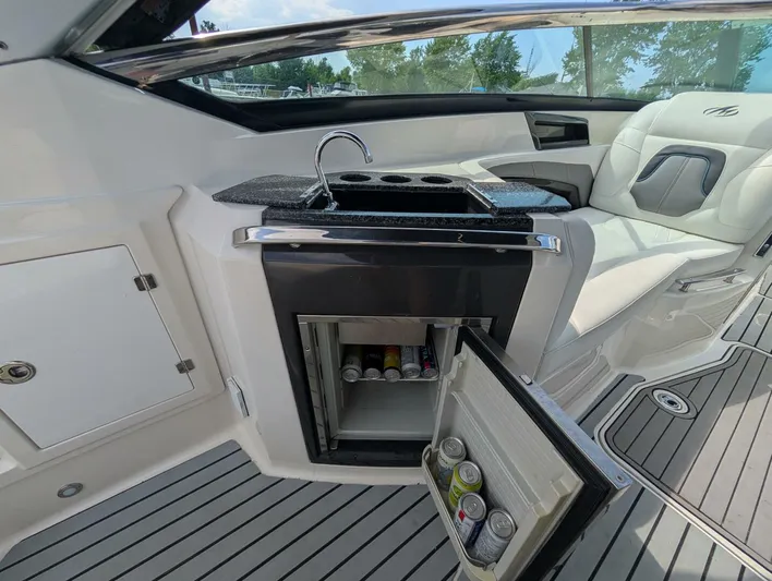  Yacht Photos Pics Luxury interior of 2011 Monterey 328 SS boat with mini fridge and seating.