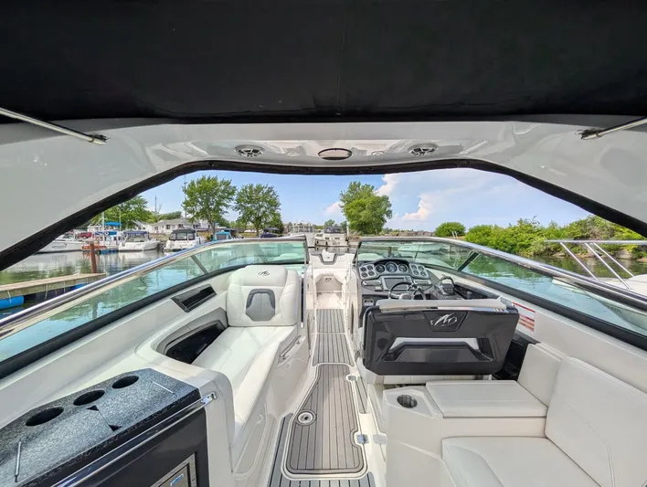  Yacht Photos Pics 2011 Monterey 328 SS boat interior with sleek design and modern dashboard, docked at marina.