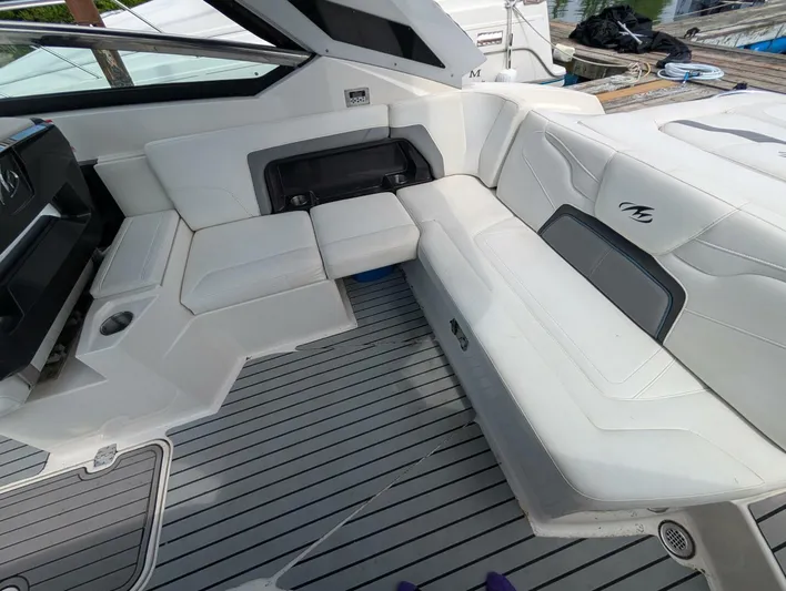  Yacht Photos Pics Interior seating of a 2011 Monterey 328 SS boat with white upholstery.