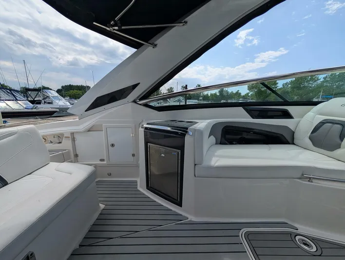  Yacht Photos Pics Interior of 2011 Monterey 328 SS boat with white seating and sleek design.