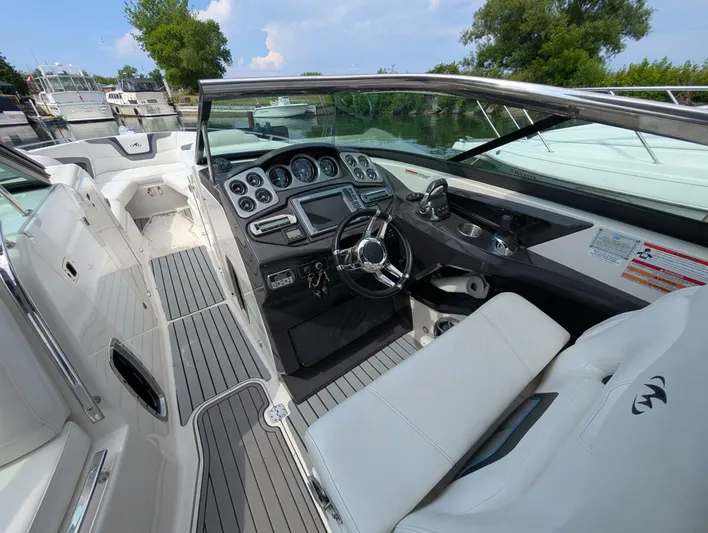  Yacht Photos Pics 2011 Monterey 328 SS boat interior with sleek dashboard and comfortable seating.