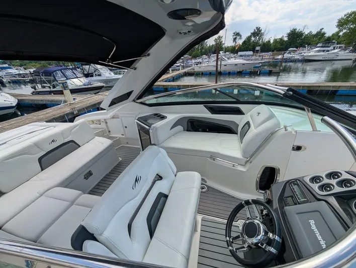  Yacht Photos Pics Luxurious 2011 Monterey 328 SS boat interior with white seating, docked at a marina.