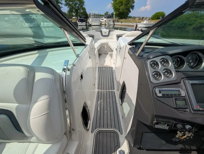  Yacht Photos Pics 2011 Monterey 328 SS boat interior with sleek dashboard and comfortable seating.